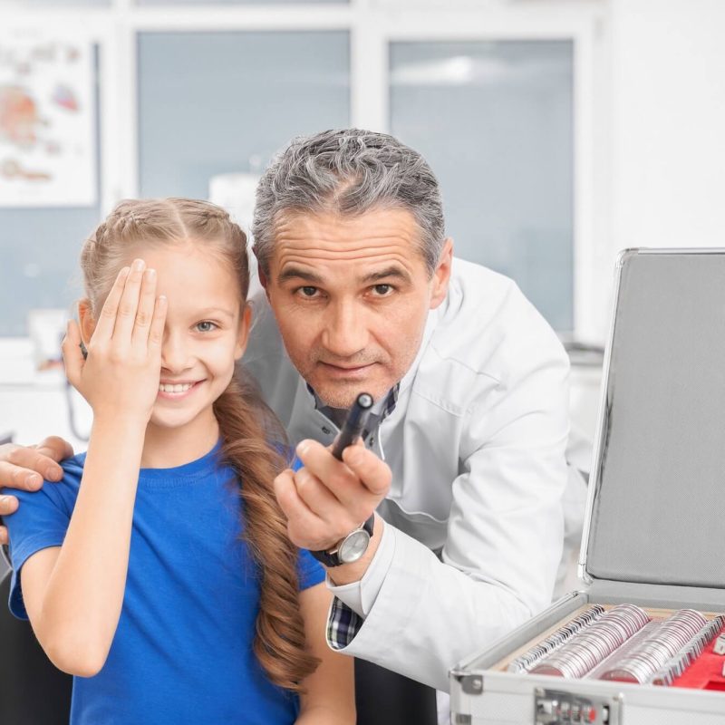 girl-closing-eye-with-hands-and-looking-at-camera-in-clinic-1.jpg